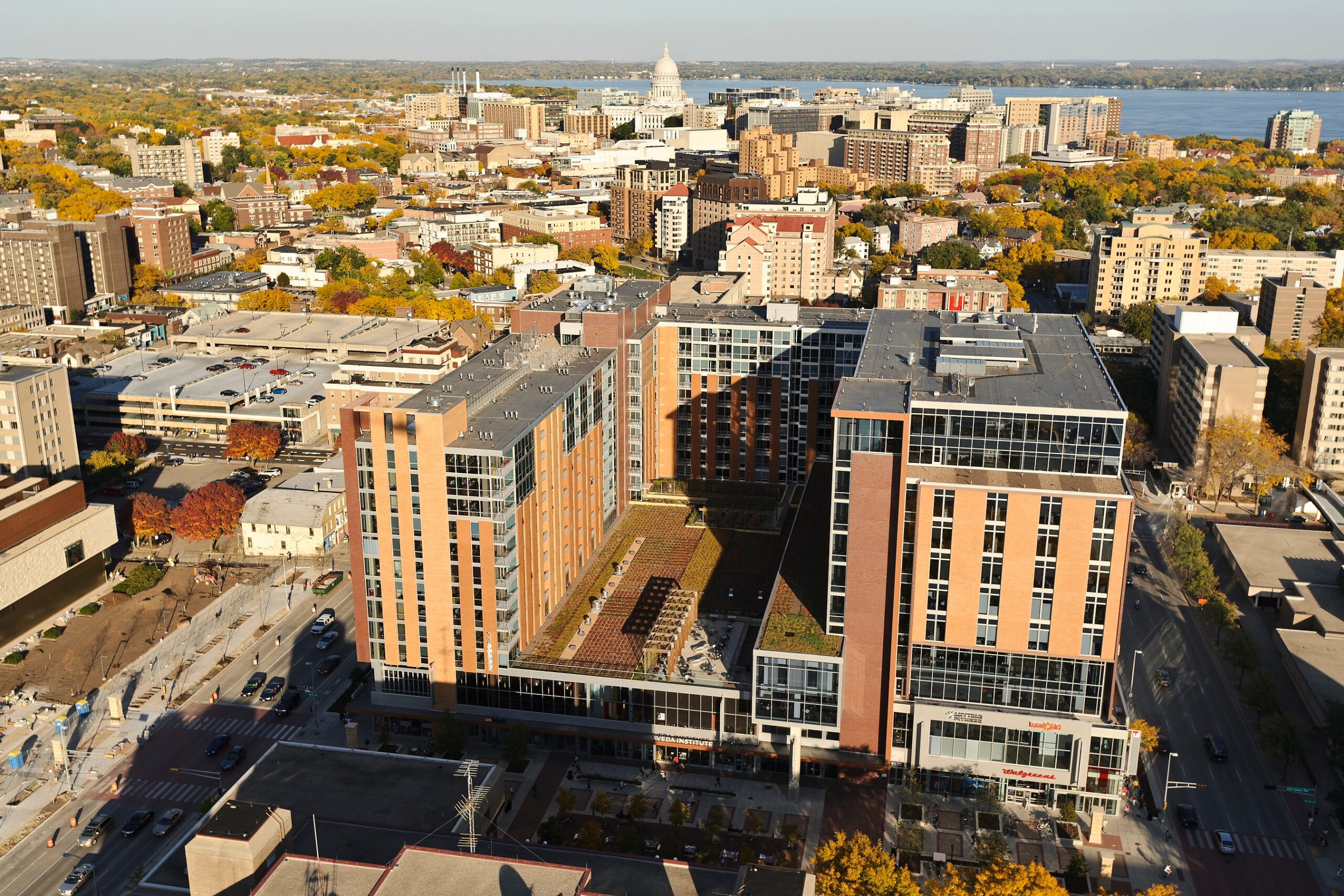 The University Square complex, including the Student Services Tower at 333 East Campus Mall at right, is pictured in an aerial view of the University of Wisconsin-Madison campus during an autumn sunset on Oct. 5, 2011. In the background is the Wisconsin State Capitol, downtown Madison skyline and Lake Monona. The photograph was made from a helicopter looking east. 